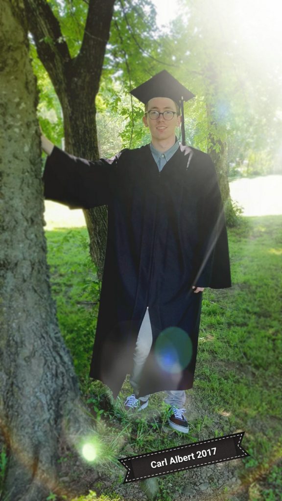 Branton Ramsey at his Carl Albert State College graduation, celebrating scholarships and digital programs.